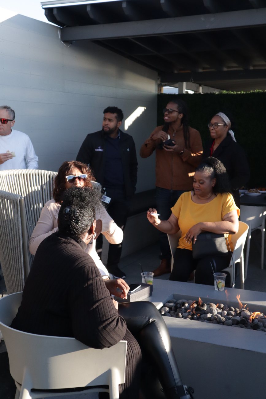 Guests talking around the fire pit