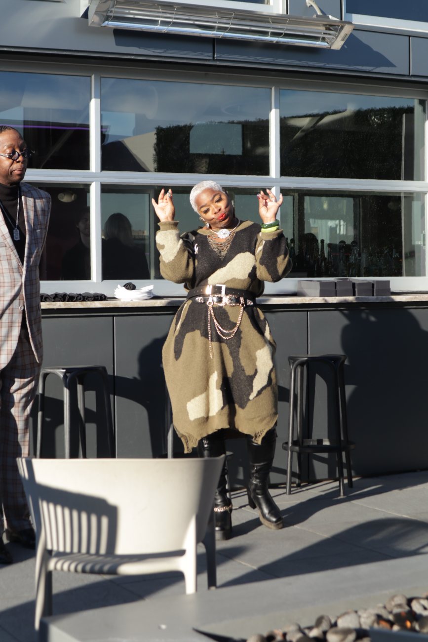 A playful moment by the rooftop bar