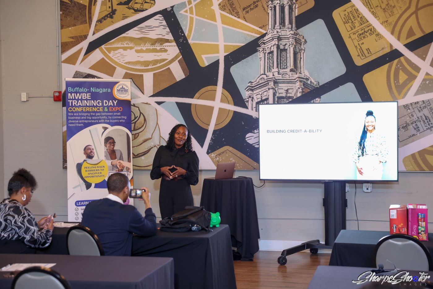A facilitator leading a business credit session for small business owners